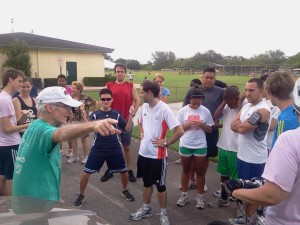 Cross-Country Coach Brother John Corcoran (pictured pointing from the front, left hand side of the photo) heads the 17th Annual Summer Fun Runs.