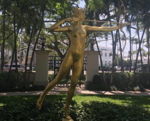 Golden sculpture of the goddess Diana with her bow and arrow.